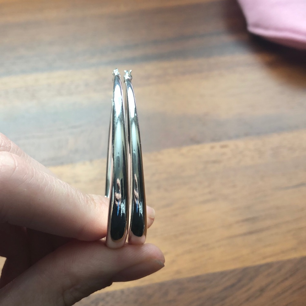 Hoop earrings w/ slight damage which is shown.
